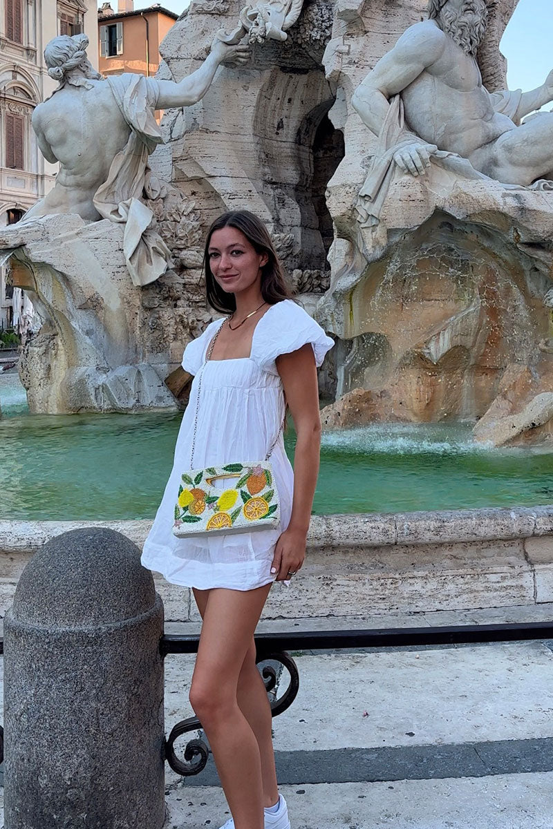 Pale lemon clutch bag shop